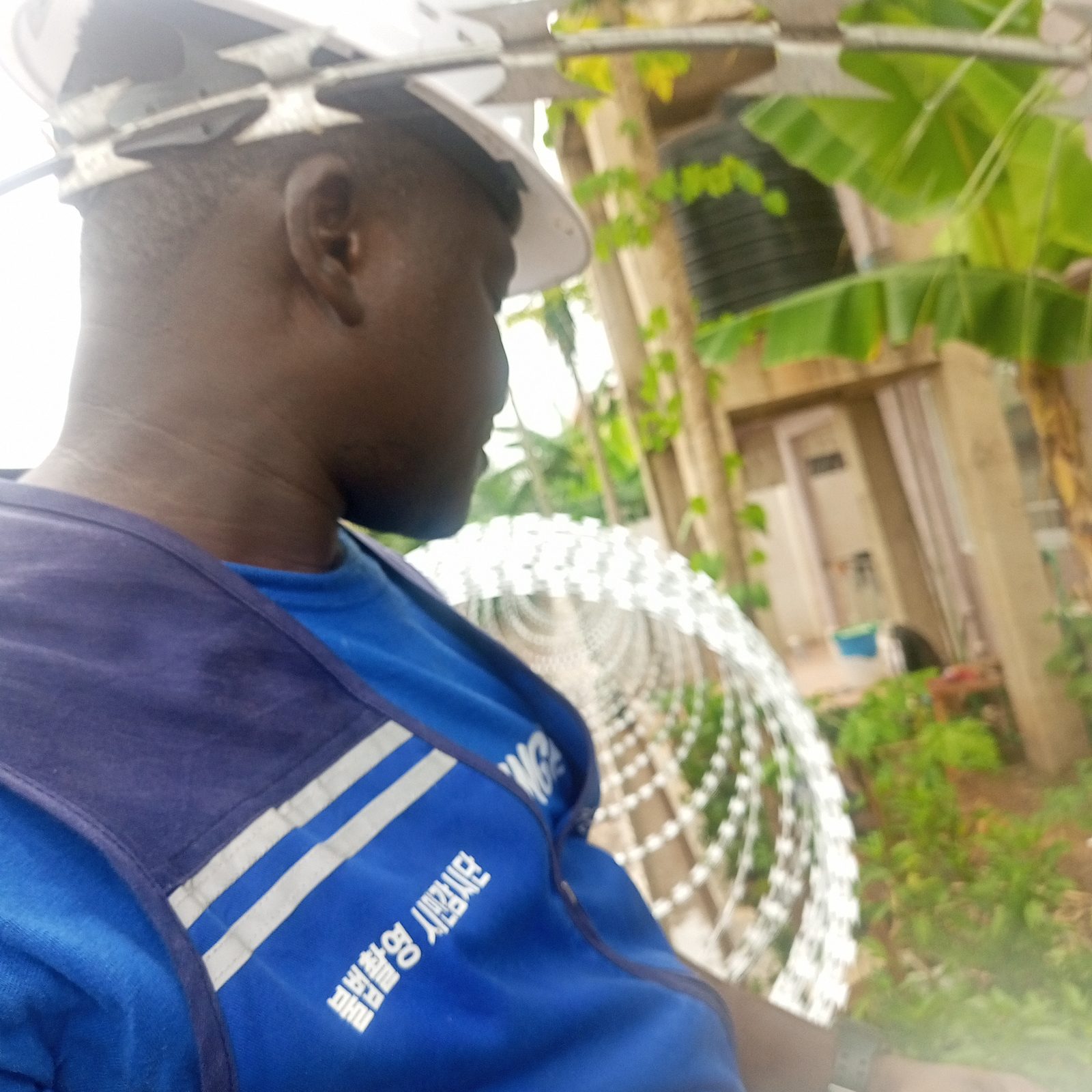 AerixSys technician on site near an installed electric perimeter security fence