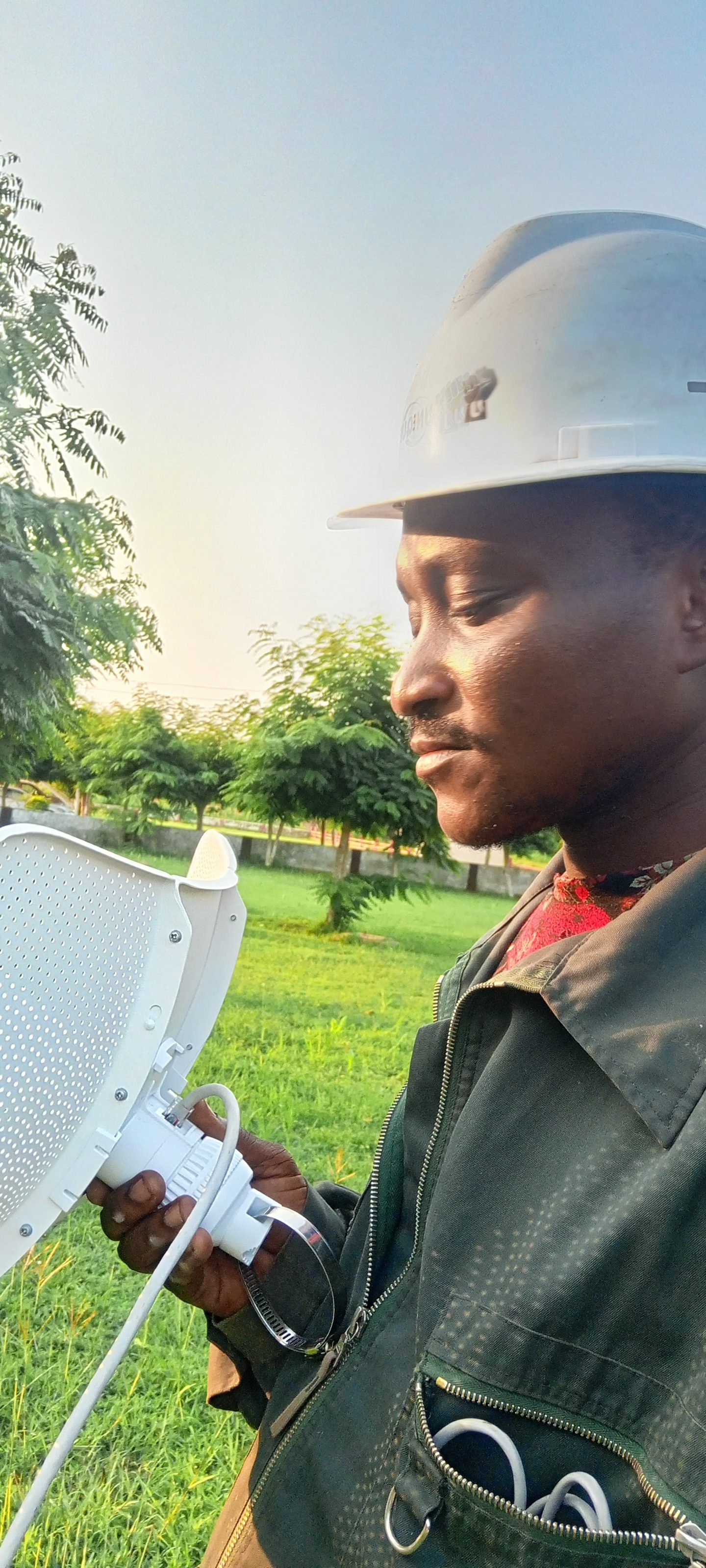 AerixSys technician aligning a point-to-point wireless network antenna on site