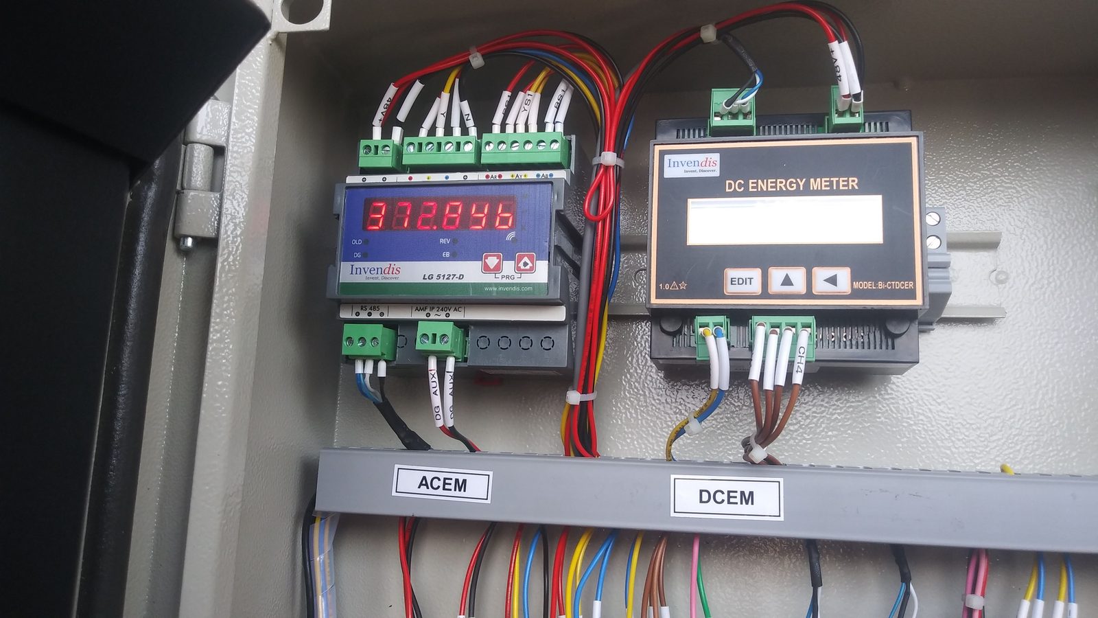 AerixSys DC and AC energy meter panel showing real-time solar system monitoring inside an installed cabinet